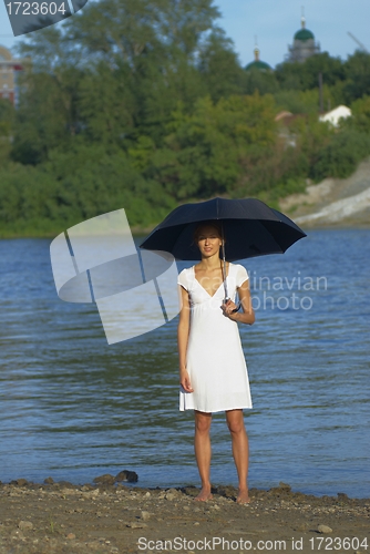 Image of Woman under umbrella
