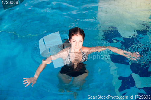 Image of Attractive girl in swimming pool