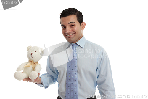 Image of Man holding a knitted teddy bear