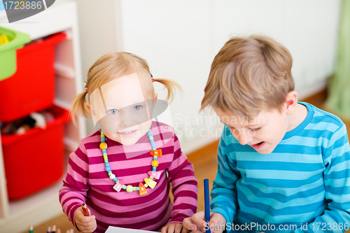 Image of Brother and sister drawing