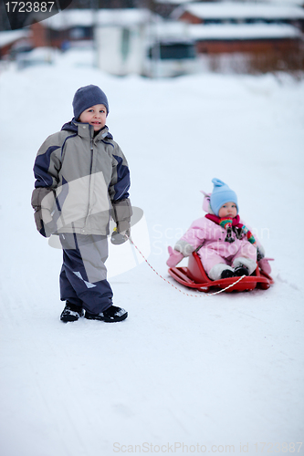 Image of Two kids outdoors on winter day