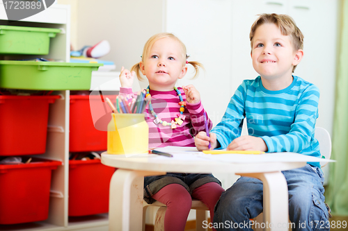 Image of Brother and sister drawing