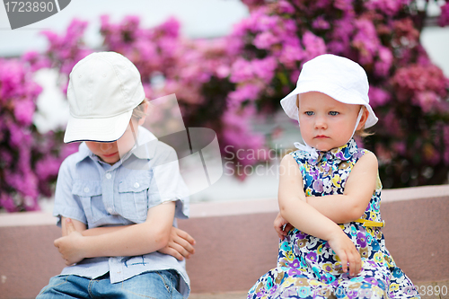 Image of Two unhappy kids outdoors
