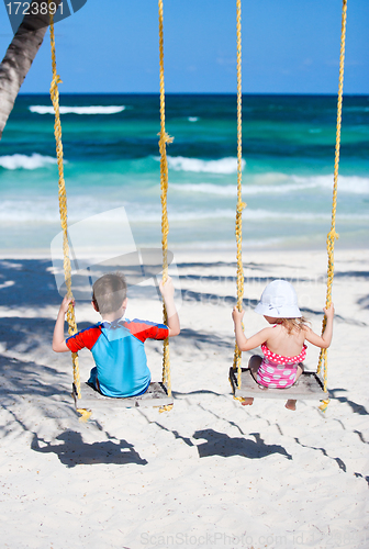 Image of Little kids swinging