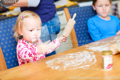 Image of Two kids baking