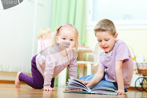 Image of Brother and sister in kids room