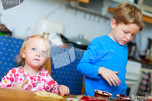 Image of Two kids baking