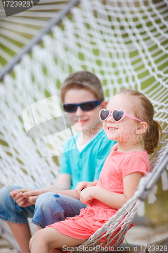 Image of Kids sitting in hammock