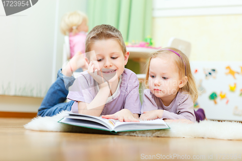 Image of Brother and sister reading