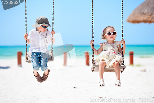 Image of Little kids swinging