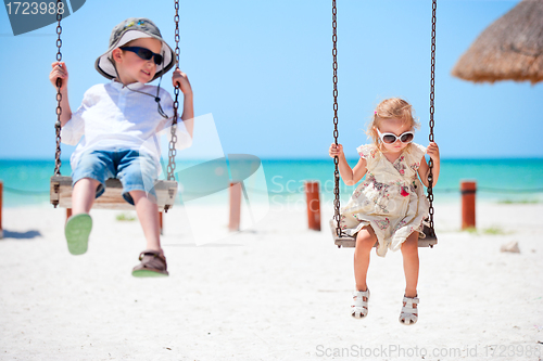 Image of Little kids swinging