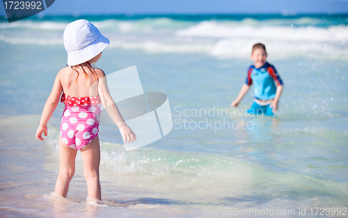 Image of Two kids playing in water