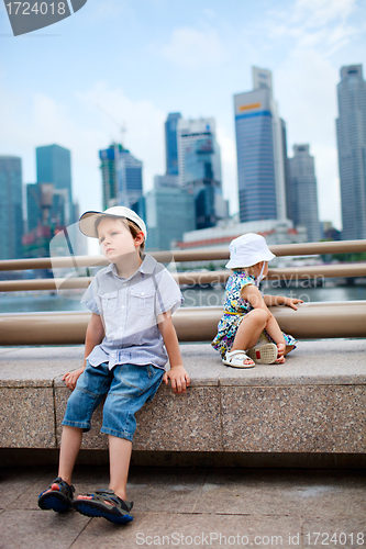Image of Two kids in big modern city