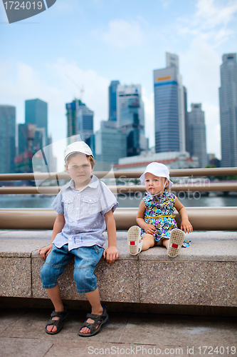 Image of Two kids in big modern city