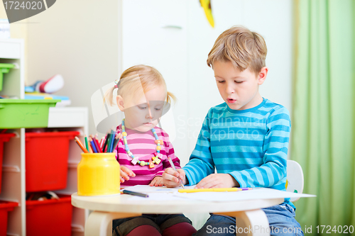 Image of Brother and sister drawing