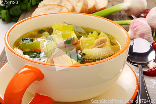 Image of Fish soup with vegetables in bowl close up. 