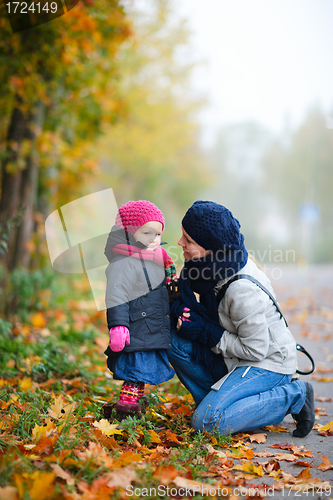 Image of Mother And Daughter Outdoors On Foggy Day