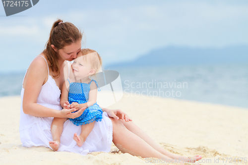 Image of Mother and baby together at beach