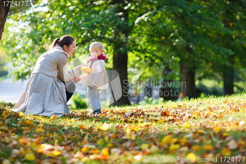 Image of Mother and daughter at autumn park