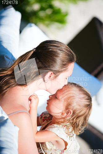 Image of Happy mother and daughter outdoors