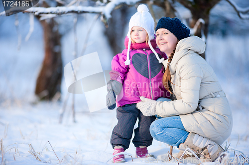 Image of Mother and daughter outdoors at winter