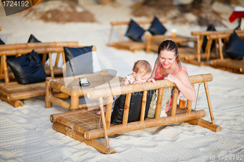 Image of Mother and daughter at beach cafe