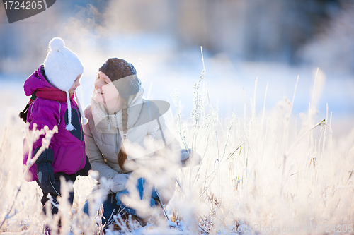 Image of Mother and daughter outdoors at winter