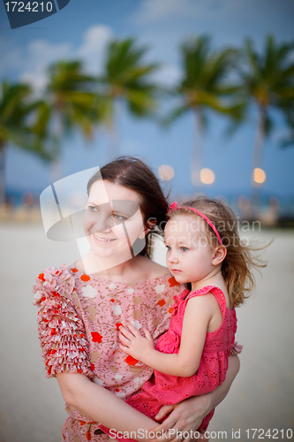 Image of Mother and daughter enjoying sunset