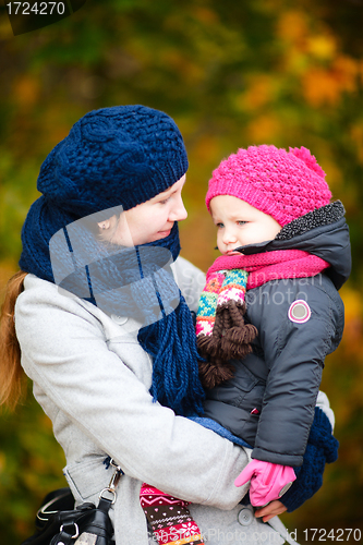 Image of Mother and daughter at autumn park