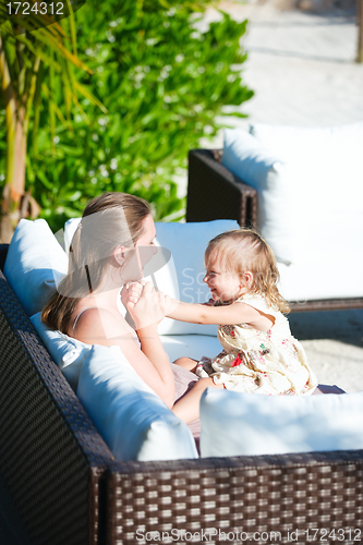 Image of Happy mother and daughter outdoors