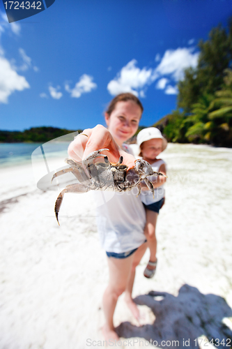 Image of Mother holding crab