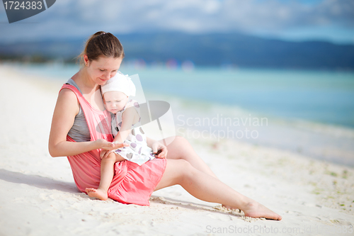 Image of Mother and daughter on tropical beach