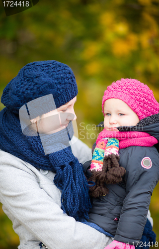 Image of Mother and daughter at autumn park