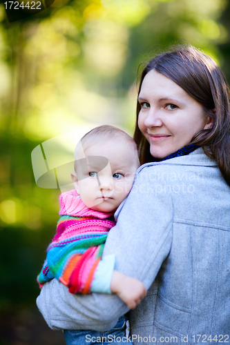 Image of Mother and daughter in autumn park