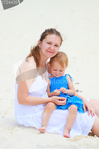 Image of Young mother and her daughter at beach