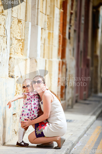 Image of Mother and daughter portrait outdoors