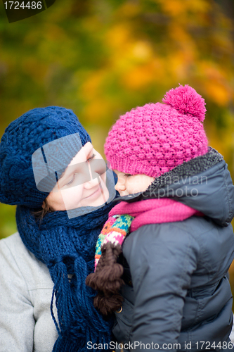 Image of Mother and daughter at autumn park