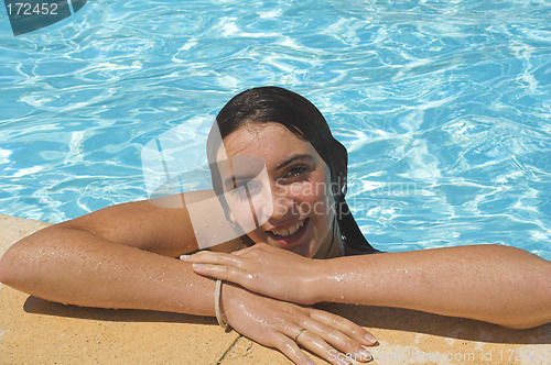 Image of girl by the pool smiling