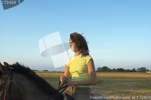 Image of girl riding a horse