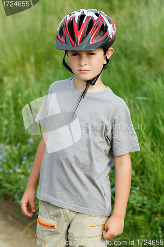 Image of portrait of boy bicyclist with helmet