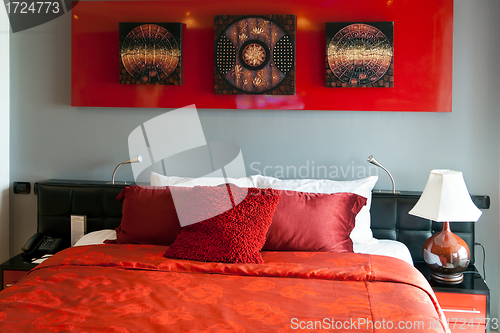 Image of Red luxurious bed in a hotel