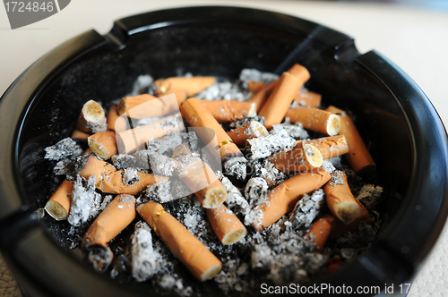 Image of Ashtray with cigarette butts