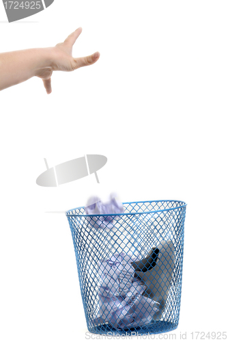 Image of Hand throwing out paper 