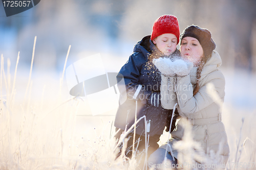 Image of Mother and son outdoors at winter