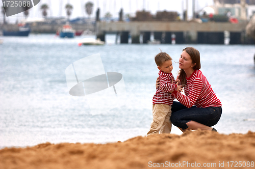 Image of Mother and son playing together outdoors