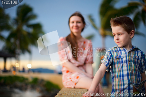 Image of Mother and son enjoying sunset