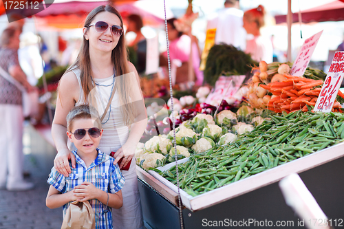 Image of Mother and son at market