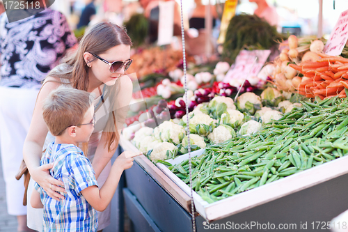 Image of Mother and son at market