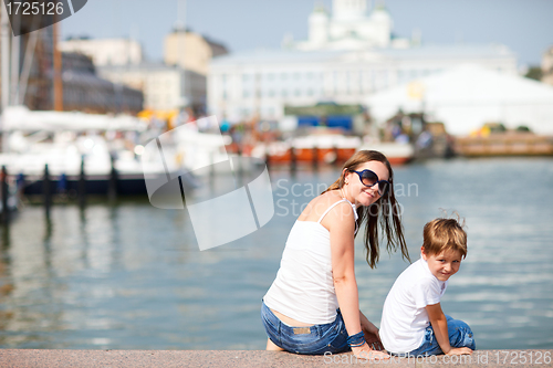 Image of Mother and son in city center Helsinki Finland