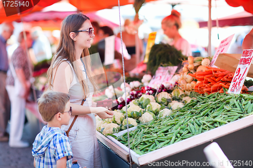Image of Mother and son at market